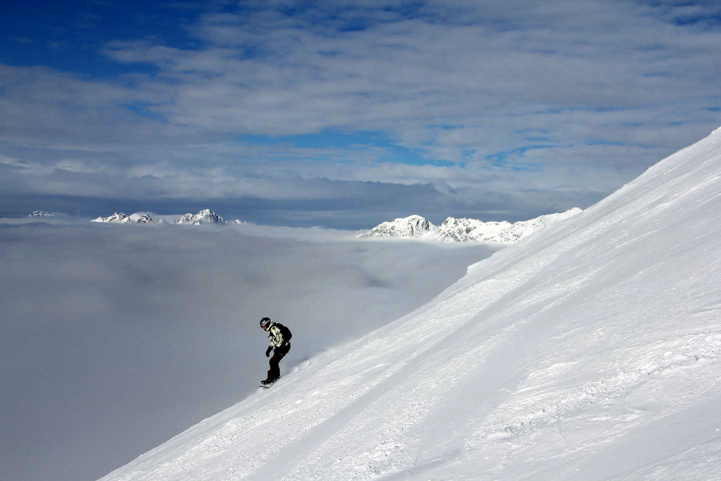 Snowboarding above the clouds © JonoVernon-Powell